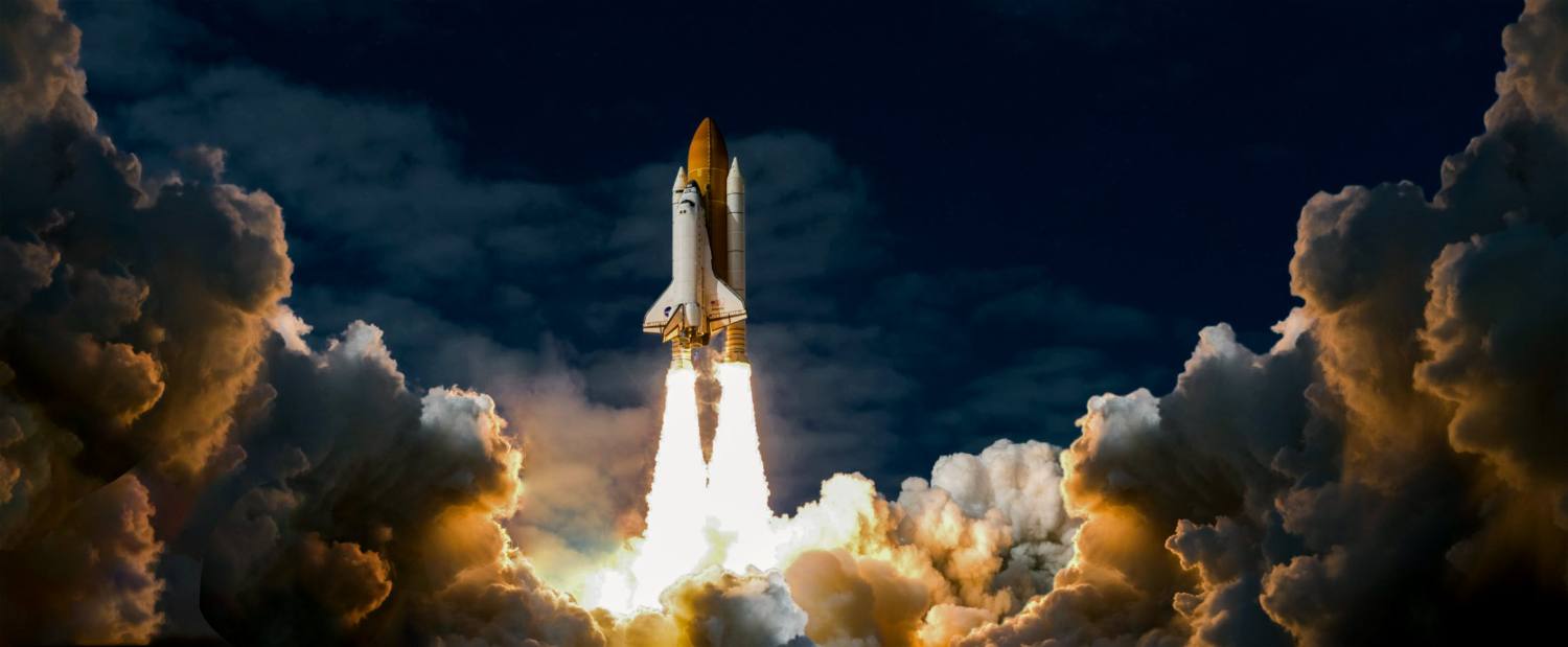 Rocket lifting off through billowing clouds